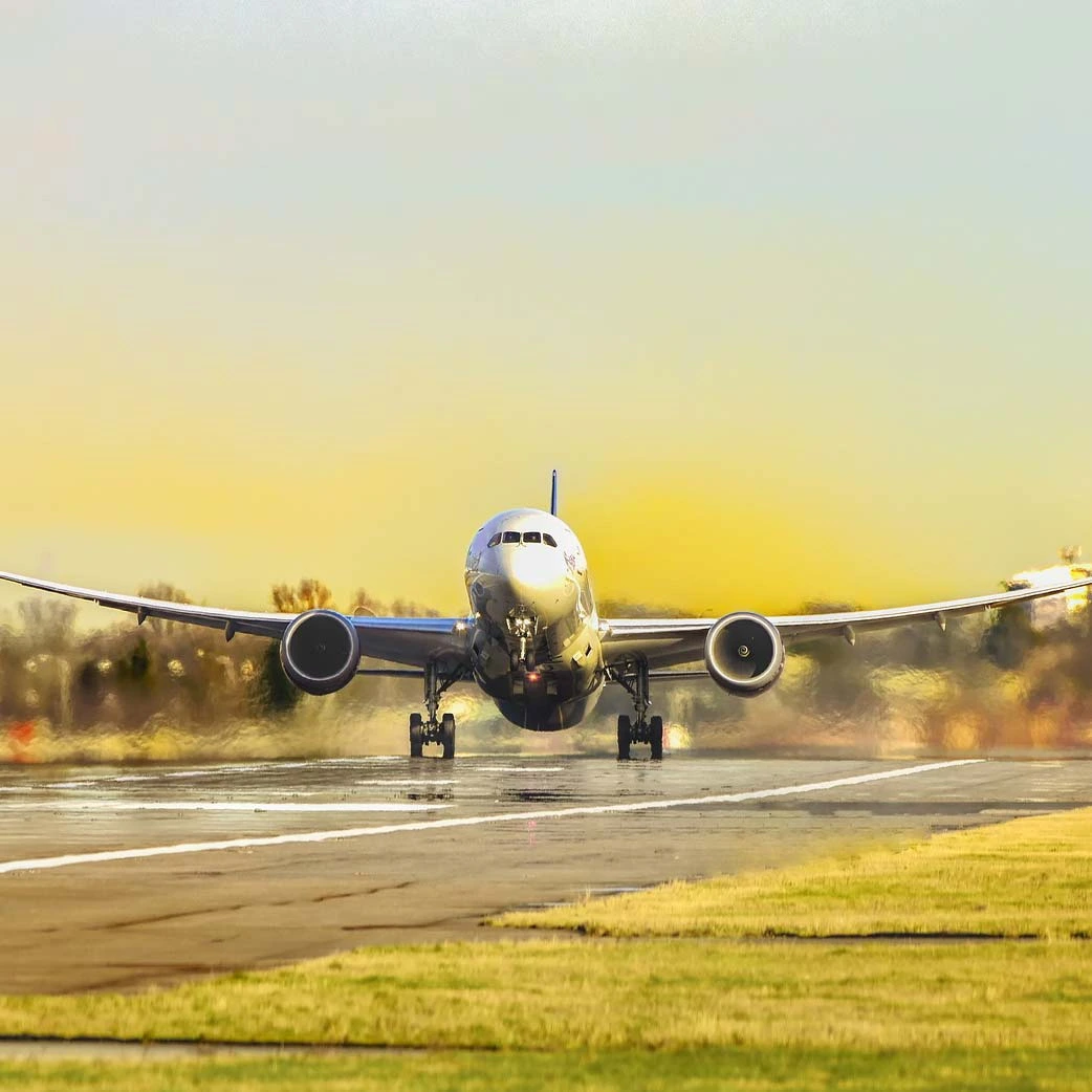 Aircraft taking off against the yellowish sky